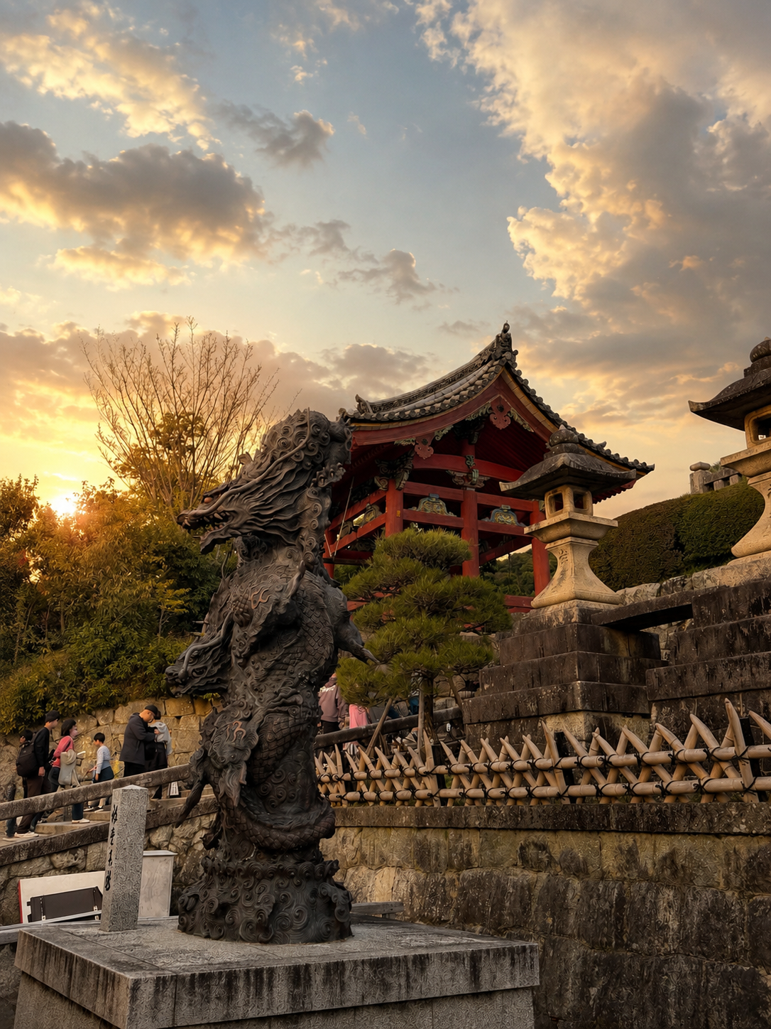 Bronze dragon sculpture in the foreground, vermillion temple gate and pagoda behind, golden-hour sky
